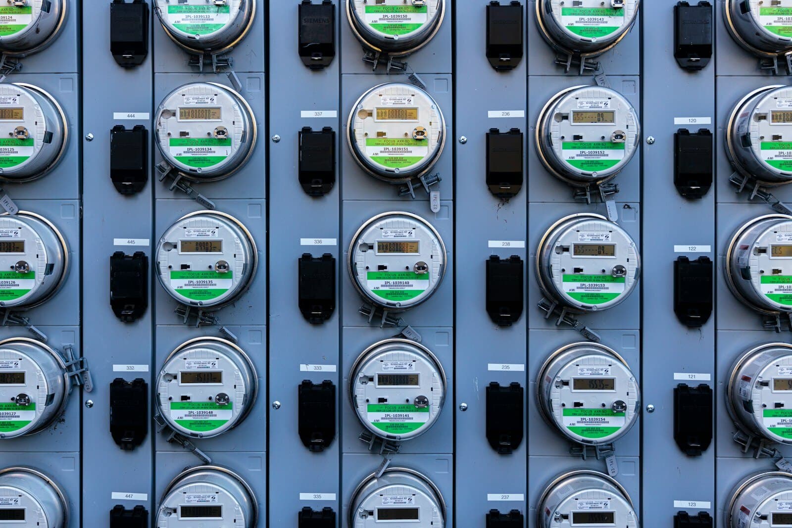 Wall of commercial electricity meters representing maximum demand billing