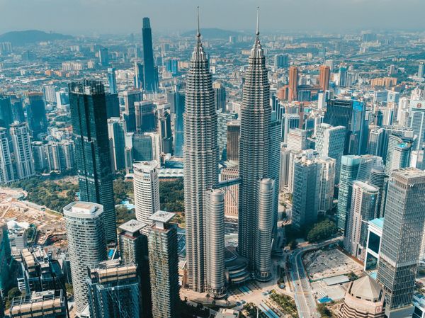 Kuala Lumpur commercial building skyline representing a multi-site property portfolio
