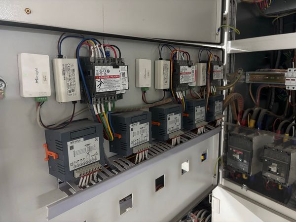 Digital power meters with Milesight LoRaWAN Modbus controllers in an electrical panel